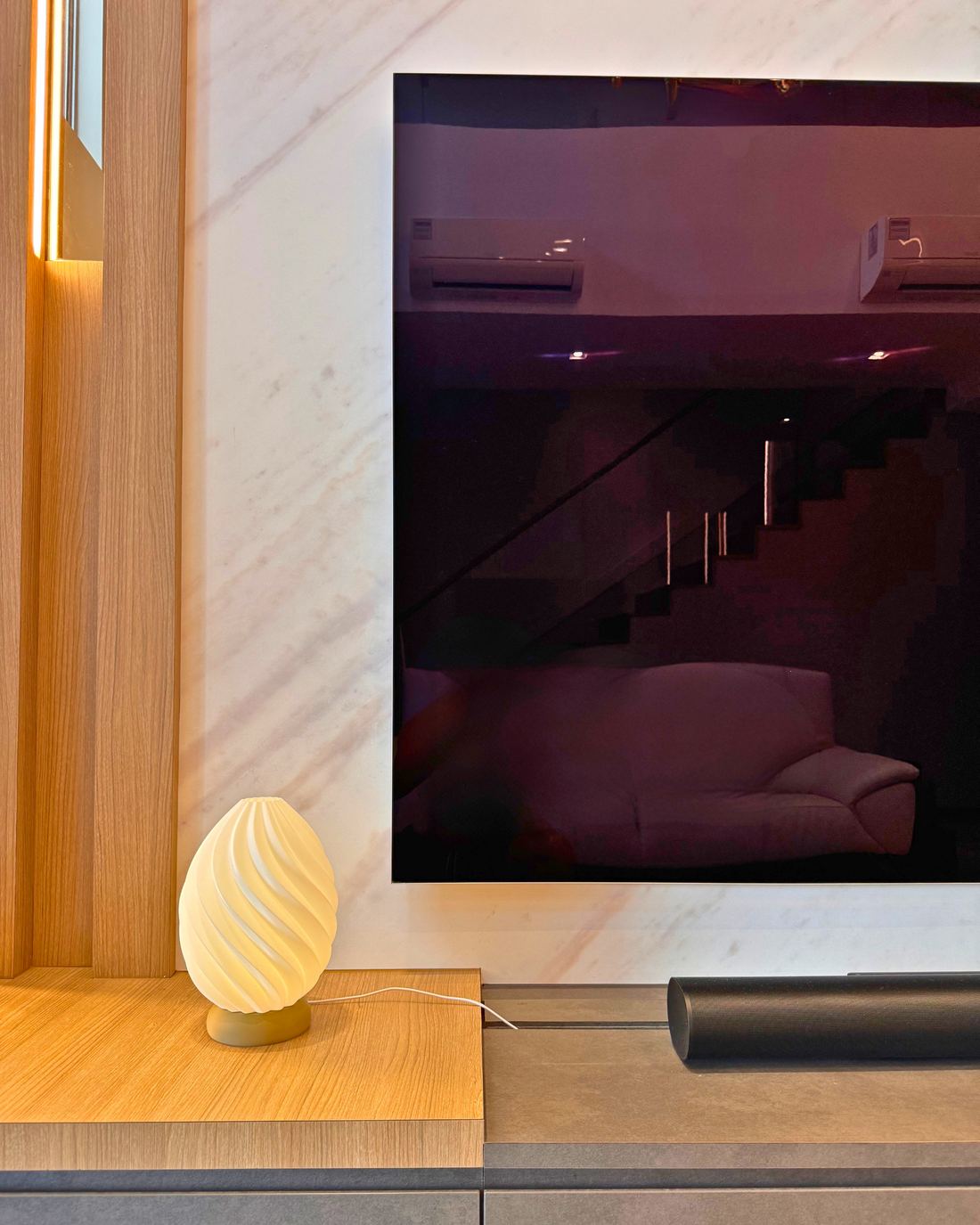 Seedlume Blossom lamp near a TV console
